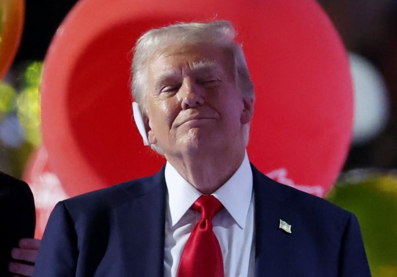 Former U.S. president Donald Trump is seen reacting after making his speech at the close of the Republican National Convention in Milwaukee on Thursday. He has accepted his party's nomination as its presidential candidate for the third straight election.