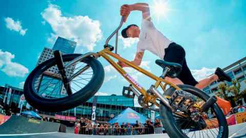 A man doing stunts with his bike