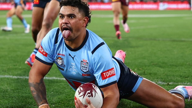 Latrell Mitchell of the Blues celebrates scoring a try.