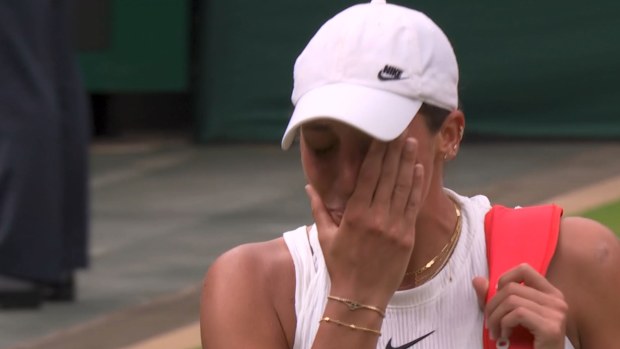 Madison Keys wipes away tears after retiring from her fourth-round match at Wimbledon. 