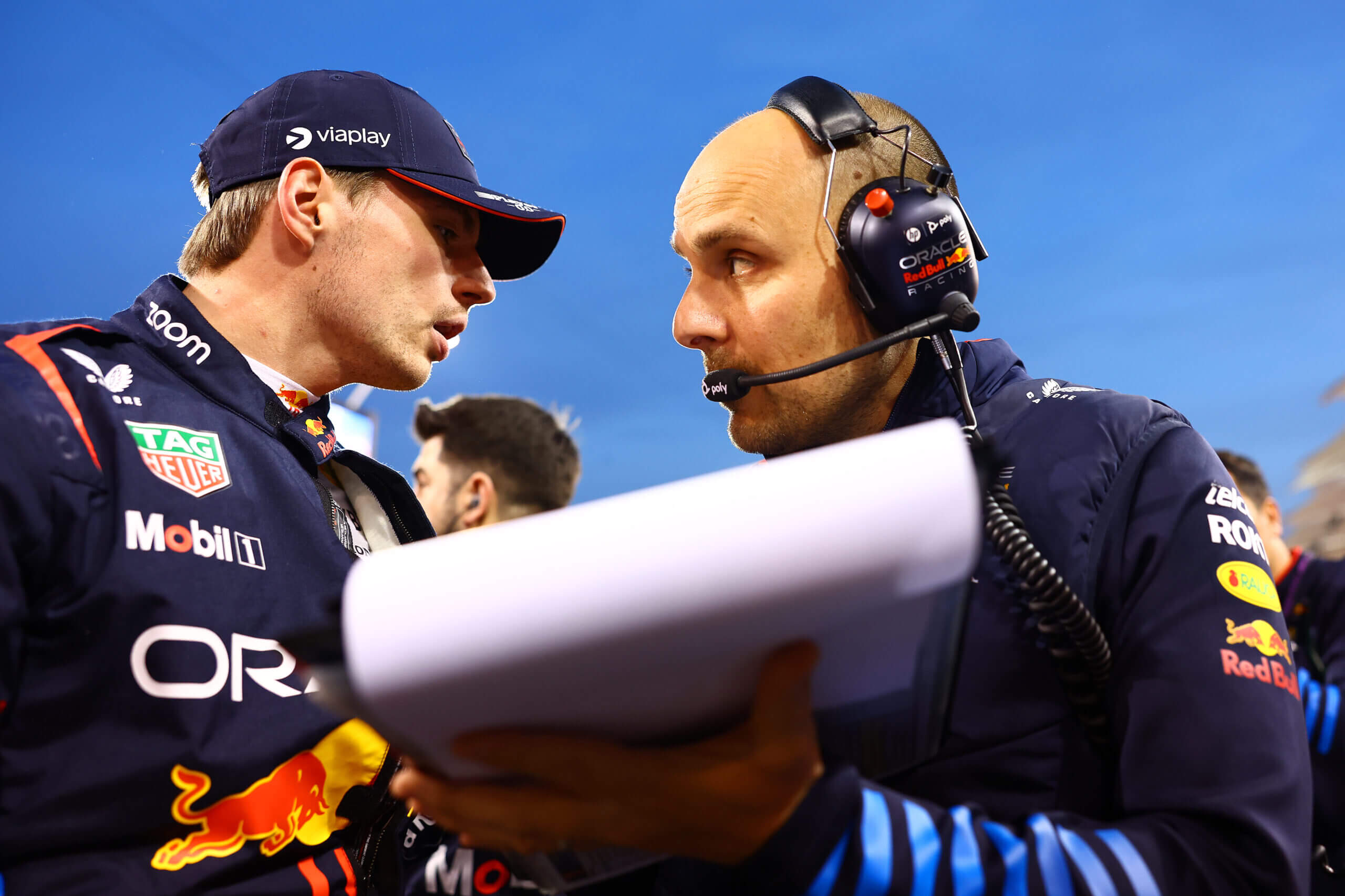 BAHRAIN, BAHRAIN - MARCH 02: Max Verstappen of the Netherlands and Oracle Red Bull Racing talks with race engineer Gianpiero Lambiase on the grid during the F1 Grand Prix of Bahrain at Bahrain International Circuit on March 02, 2024 in Bahrain, Bahrain. (Photo by Mark Thompson/Getty Images)