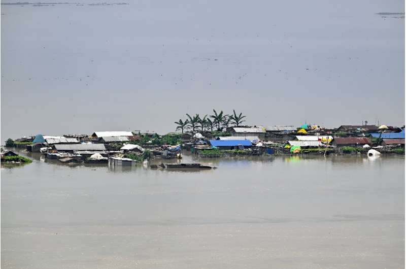 Heavy rains and overflowing rivers have swamped parts of India's northeastern state of Assam