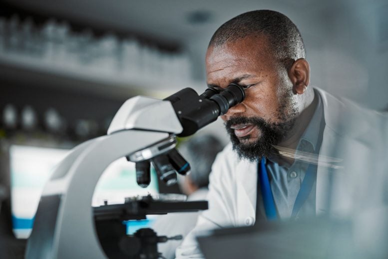 Scientist Using Microscope