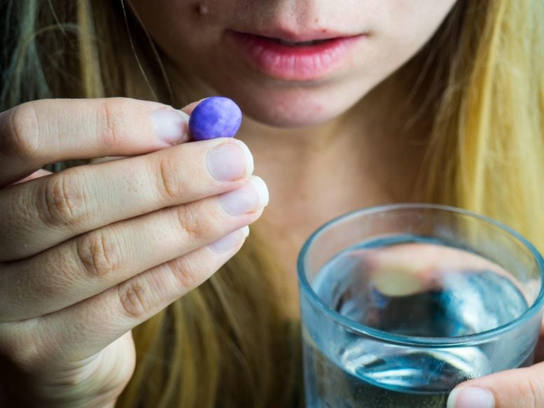 Woman Taking Antidepressant Pill