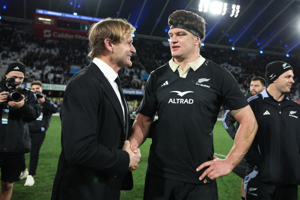 All Blacks head coach Scott Robertson (left) shakes hands with captain Scott Barrett after defeating England in Dunedin.