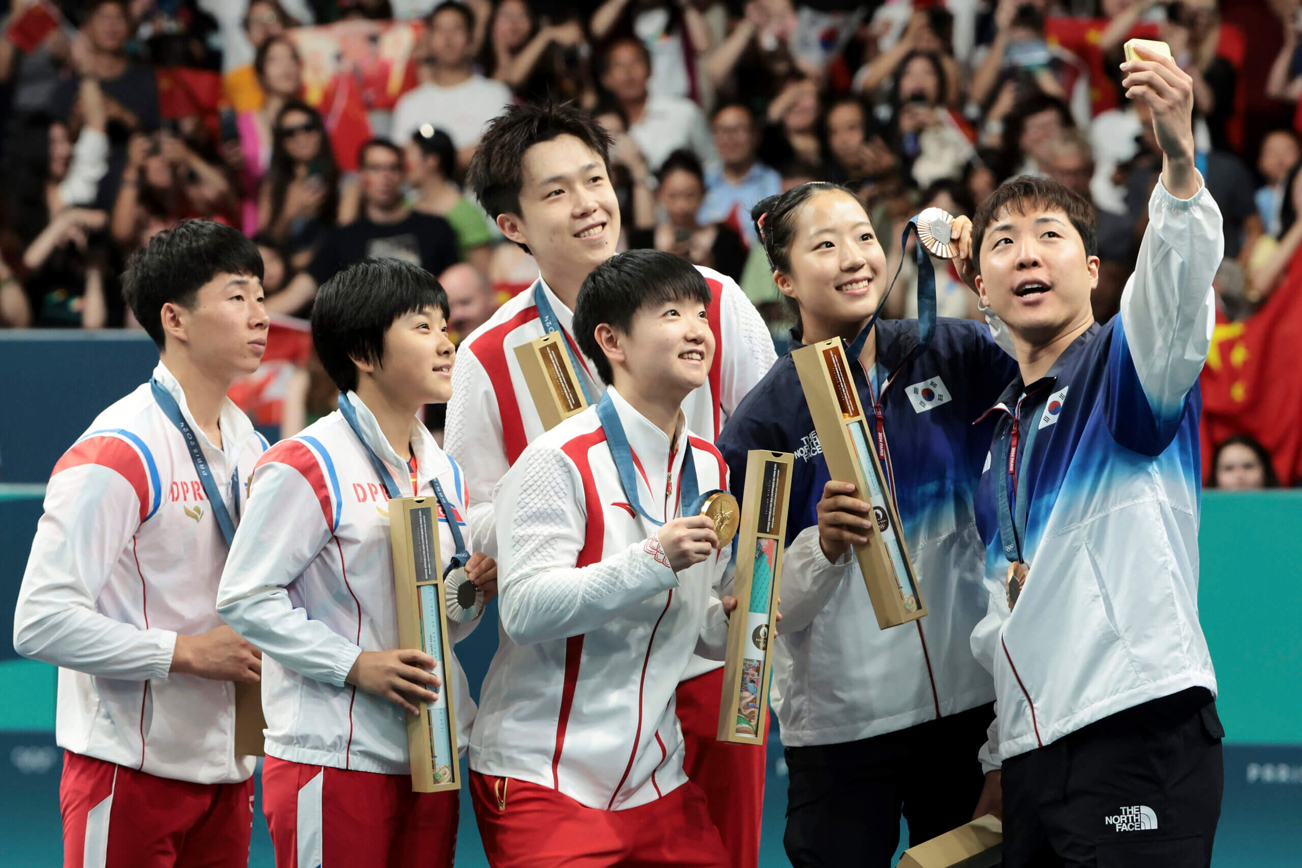 All six mixed double medal winners posed for the selfie (Jean Catuffe/Getty Images)