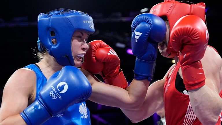 Poland's Aneta Rygielska, left, puches, Britain's Rosie Eccles, during women's 66kg at the 2024 Summer Olympics, Sunday, July 28, 2024, in Paris, France. (AP Photo/John Locher)