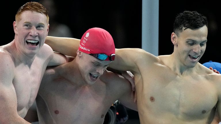 Britain's men's 4x200-meter freestyle relay team celebrates after winning the 2024 Summer Olympics, Tuesday, July 30, 2024, in Nanterre, France. (AP Photo/Ashley Landis)