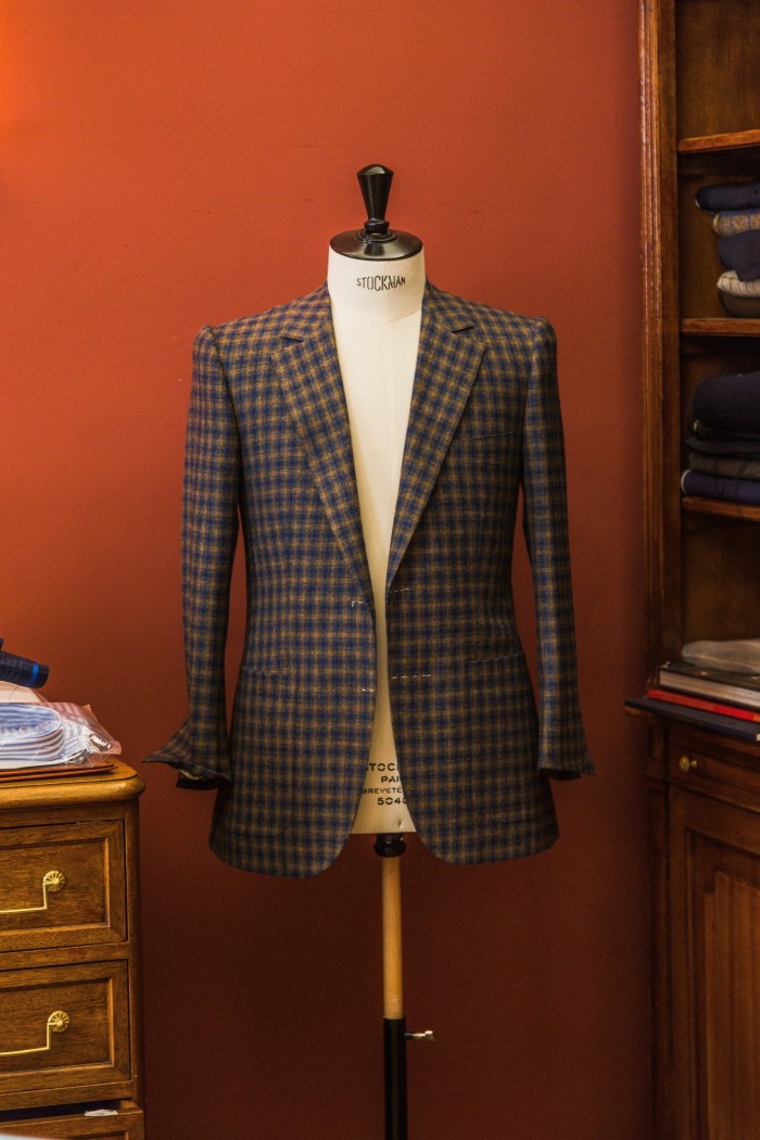 A chequered coat on a tailor’s dummy