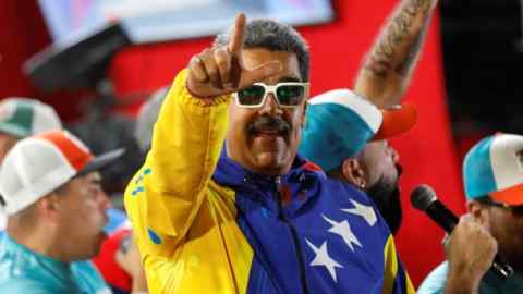 Venezuelan President Nicolas Maduro celebrates after the presidential election in Caracas