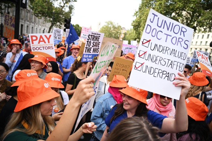 Junior doctors protest in Whitehall over pay and conditions