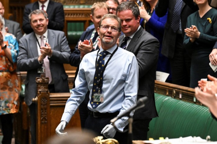 Britain’s Conservative MP Craig Mackinlay acknowledging applauds and cheering at the start of the weekly session of Prime Minister’s Questions in the House of Commons in central London, on May 22, 2024 on the day of his return