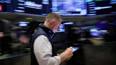 A trader on the floor at the New York Stock Exchange