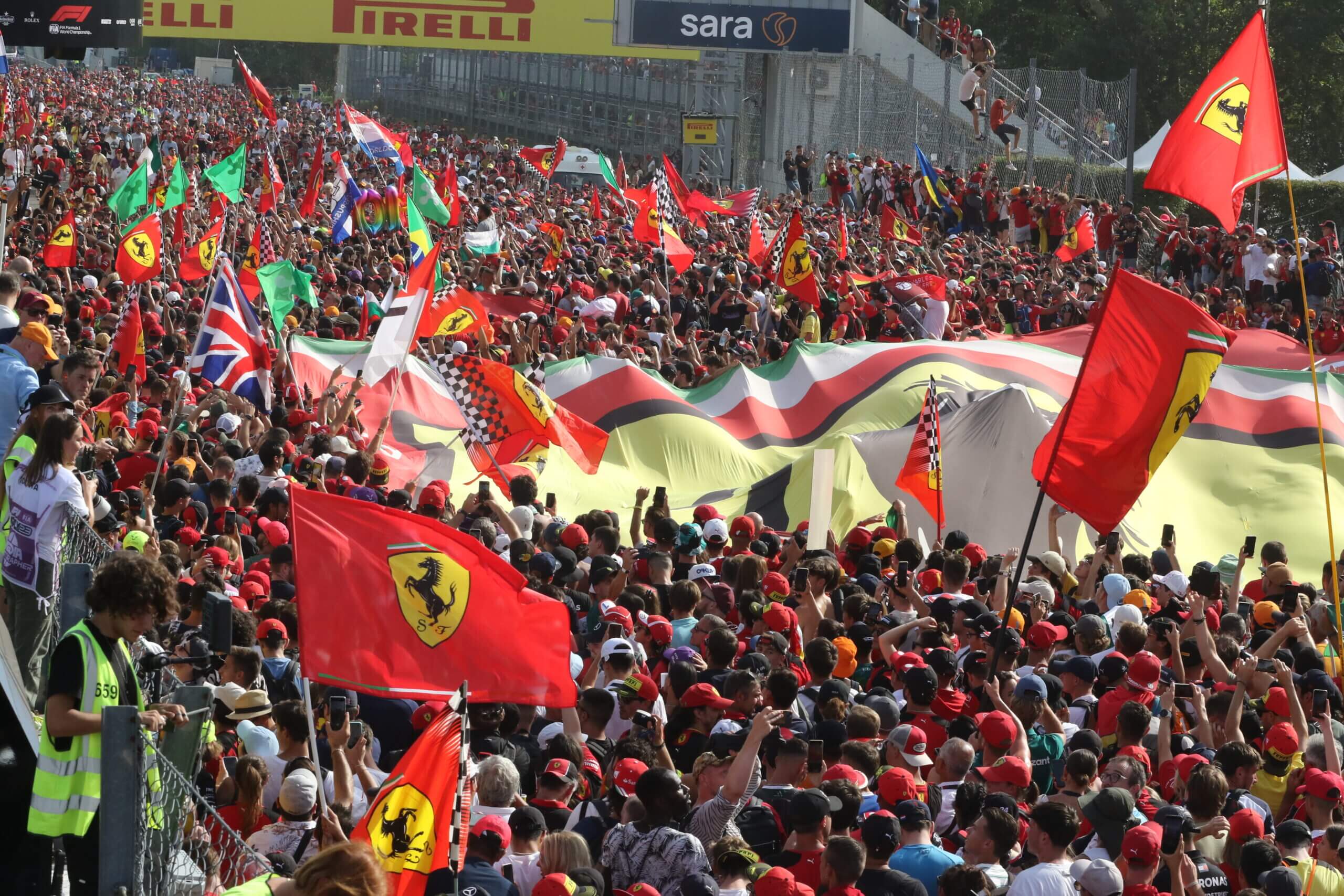 MONZA, ITALY - SEPTEMBER 03: Fans and Supporters after the race at the podium on podium during the F1 Grand Prix of Italy at Autodromo Nazionale Monza on September 03, 2023 in Monza, Italy. (Photo by Arthur Thill ATPImages/Getty Images)