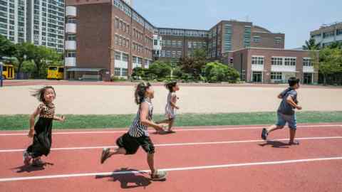 South Korea children playing in a school ground