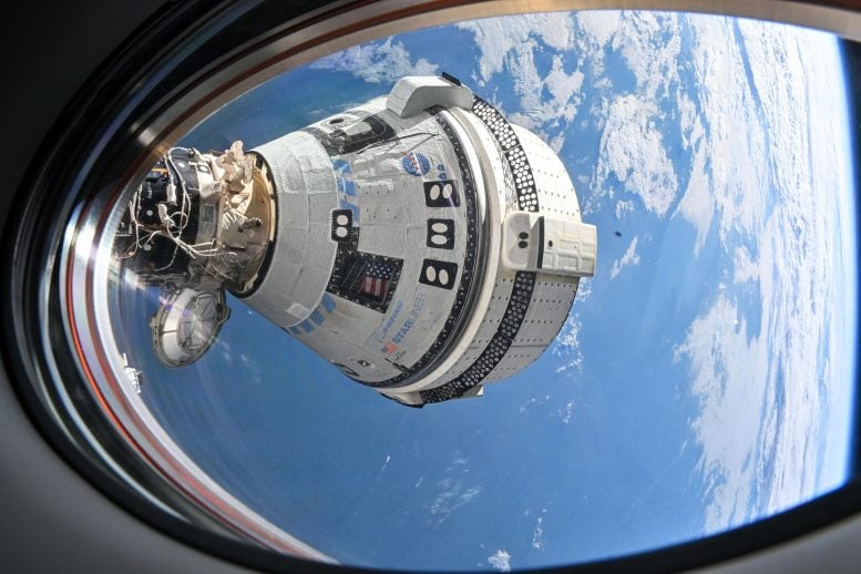 Boeing Starliner Spacecraft Docked to the Harmony Module From a Window on the SpaceX Dragon Endeavour