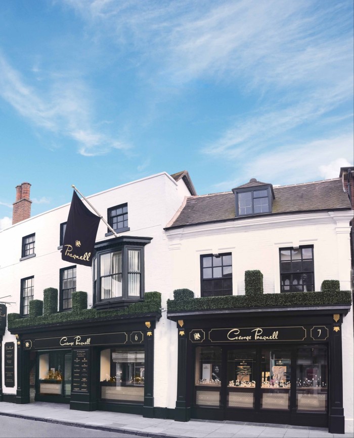 the exterior of a white building housing a high-end jewellery store