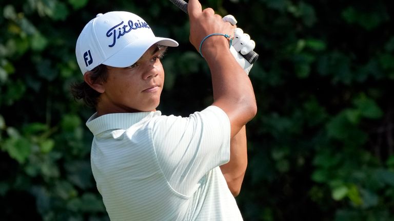 Charlie Woods hits off the 15th tee during the second round of stroke play of the U.S. Junior Amateur Golf Championship, Tuesday, July 23, 2024, in Bloomfield Township, Mich. (AP Photo/Carlos Osorio)