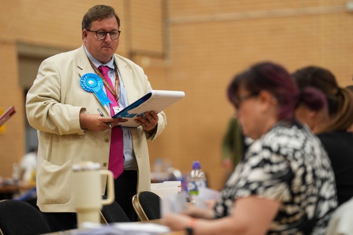 Count verifiers watch as votes are counted at Alive Lynnsport in King’s Lynn, Norfolk