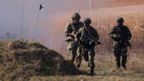 Soldiers of the United Kingdom’s 2nd Battalion Royal Anglian infantry unit storm an enemy position in a simulated attack during the NATO ‘Brilliant Jump’ military exercises