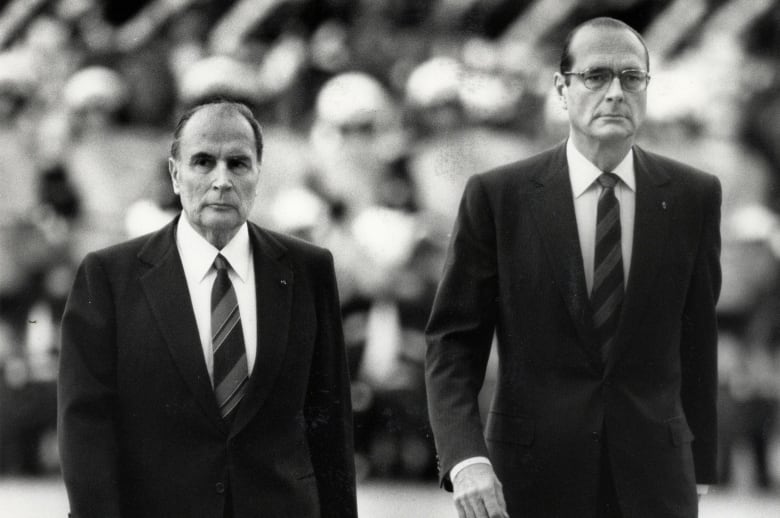 In May 1986, France's then-president François Mitterrand and then-prime minister Jacques Chirac are seen attending a ceremony in Paris.