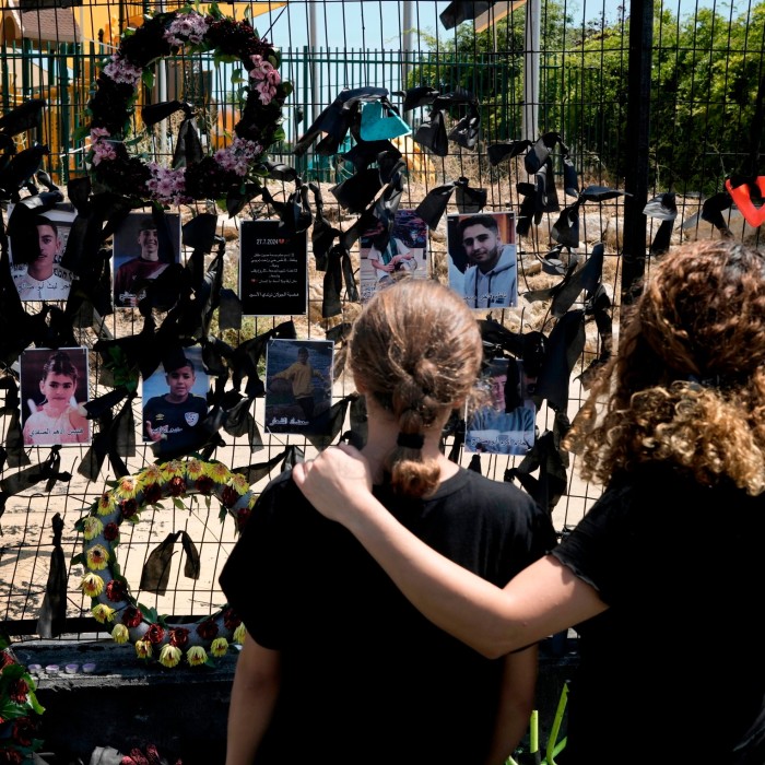 Druze visit a makeshift memorial for the 12 children and teens who were killed