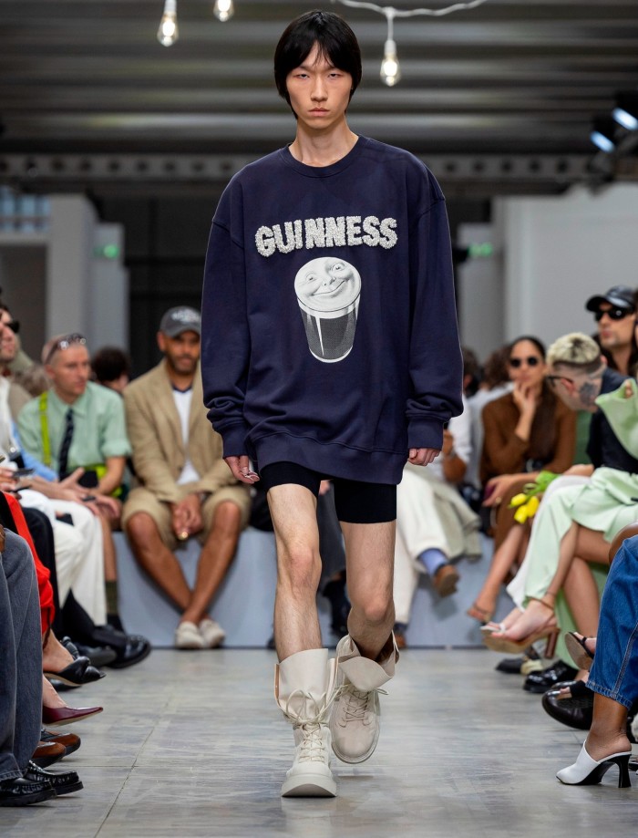 A model wears a Guinness branded top at the Milan Menswear fashion show