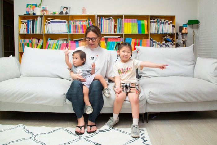 Irene Kim with her two children at her apartment in Dongtan 