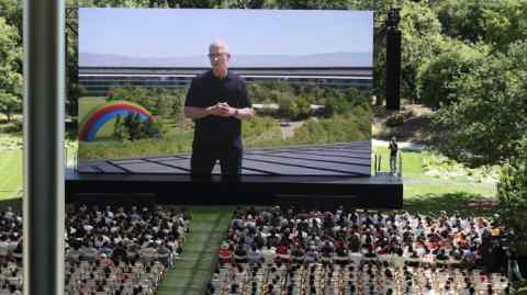 Tim Cook speaks on a stage at the Apple Worldwide Developers Conference in Cupertino on Monday