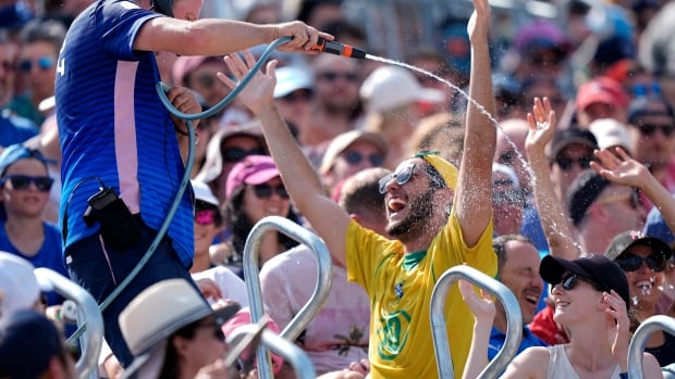 Paris sizzles under heat wave as Olympic athletes and fans try to stay cool