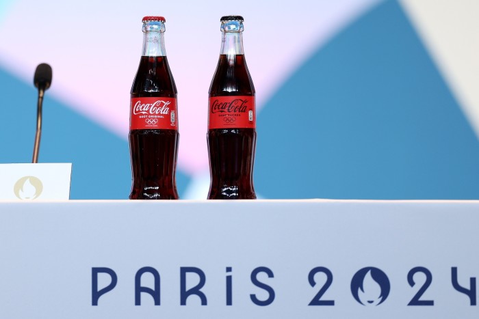 Bottles of Coca-Cola are seen during the Paris 2024 President and CEO press conference