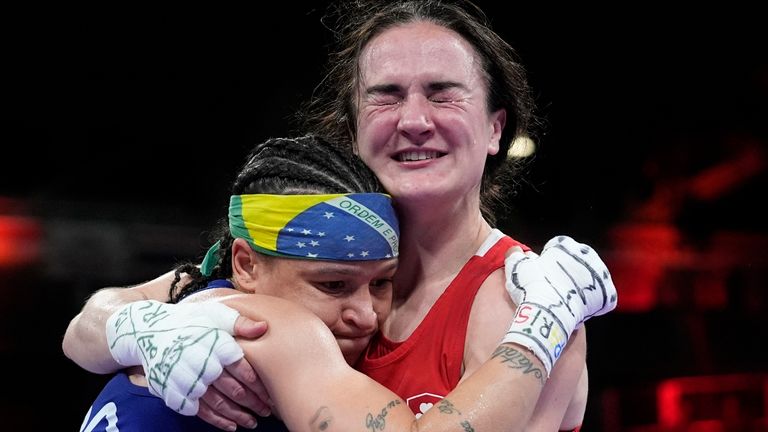 Ireland's Kellie Harrington, right, hugs Brazil's Beatriz Soares after defeating her in their women's 60kg semifinal boxing match at the 2024 Summer Olympics, Saturday, Aug. 3, 2024, in Paris, France. (AP Photo/John Locher)