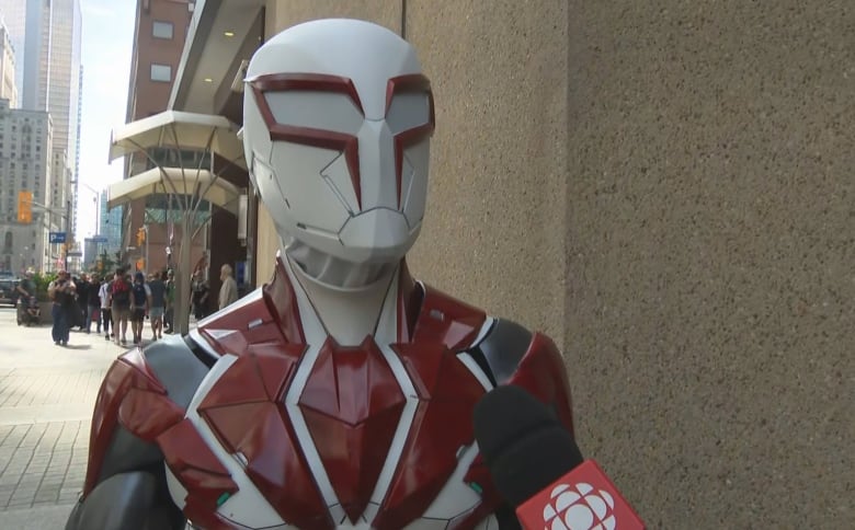 Romil Martinez, a resident of Sudbury, Ont., was at the event in his Spiderman 2029 costume, which he 3-D printed and assembled himself. He says: 'It's my thing. I love games, cosplays, stuff . It's very nice, To see all of my friends at this convention, it's very amazing.'