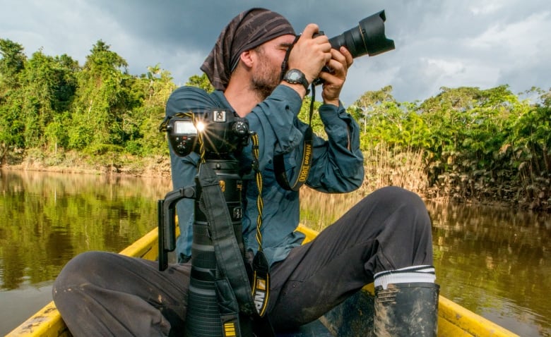 Neil Ever Osborne in a swamp near the Tiputini Biodiveristy Station in Ecuador.