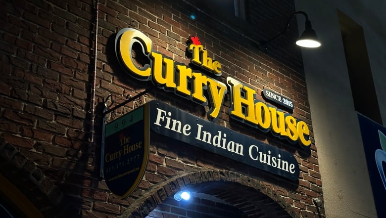 curry house sign reads "fine indian cuisine"