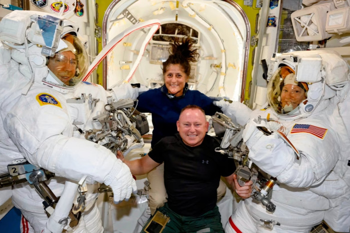 Boeing Crew Flight Test astronauts Suni Williams and Butch Wilmore pose with Expedition 71 Flight Engineers Mike Barratt and Tracy Dyson aboard the International Space Station’s Quest  