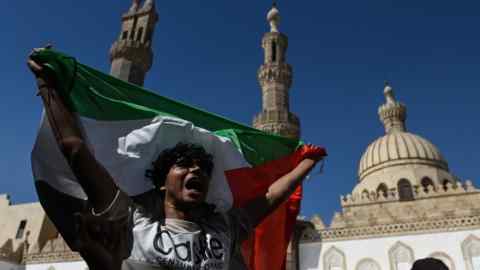 A demonstrator shouts slogans during a protest in support of the Palestinian people in Cairo, Egypt.