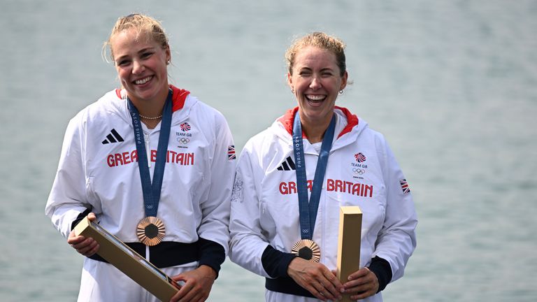 Rebecca Wilde and Mathilda Hodgkins Byrne from Great Britain celebrate with bronze medals.