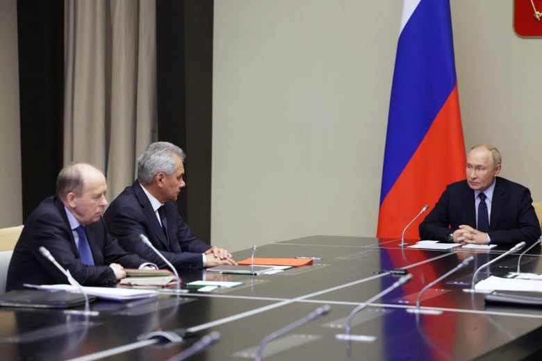 Russian President Vladimir Putin chairs a meeting Wednesday with officials about the situation in Kursk region, where Russian officials say Ukrainian forces have attacked.