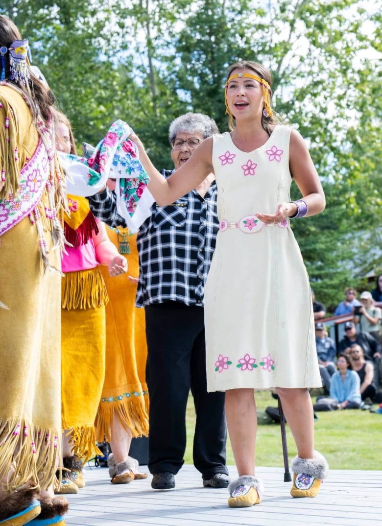 Person wearing regalia at a performance