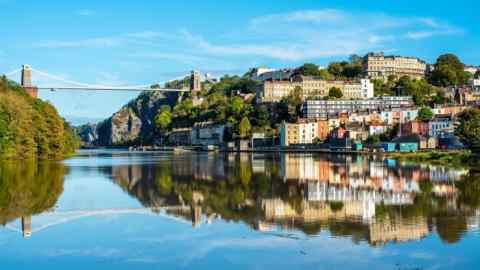 Bristol’s Clifton Suspension Bridge and city reflected in the River Avon