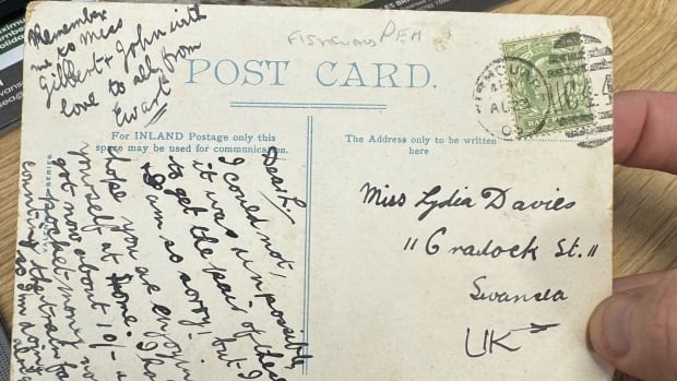 An old postcard with writing in black ink.