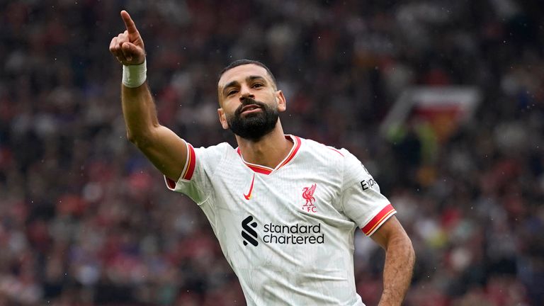 Liverpool's Mohamed Salah celebrates after scoring their third goal (AP Photo/Dave Thompson)