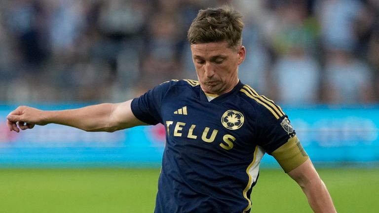 Vancouver Whitecaps attacker Ryan Gauld kicks the ball during the first half of an MLS soccer match Wednesday, May 29, 2024, in Kansas City, Kan. (AP Photo/Charlie Riedel)