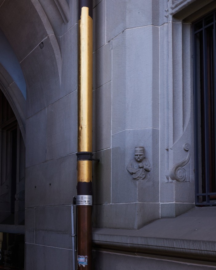 A drainpipe on the facade of the city hall painted gold by artist and Yello frontman Dieter Meier as part of his citywide 2008 installation ‘Le Rien en Or’