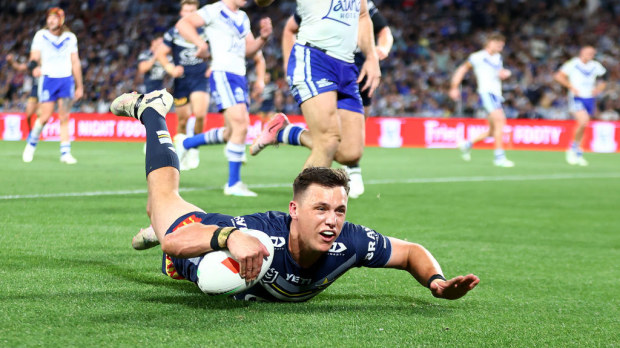 Scott Drinkwater of the Cowboys scores a try during the round 27 NRL match between Canterbury Bulldogs and North Queensland Cowboys.