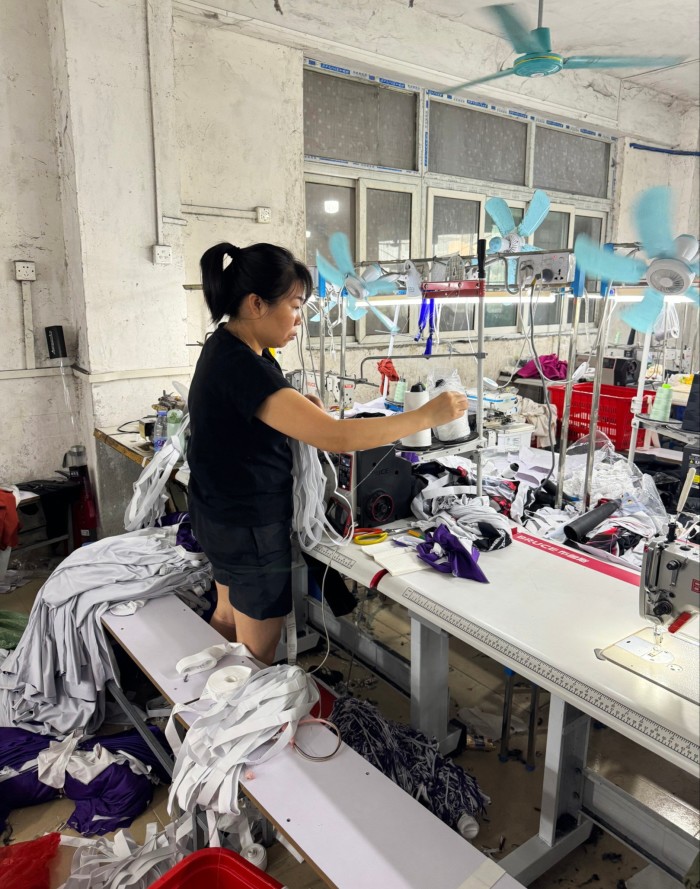 A female worker sewing clothing