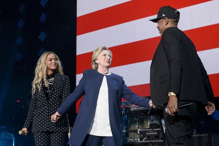 Democratic presidential nominee Hillary Clinton (C) stands with Beyonce (L) and Jay Z  in 2016