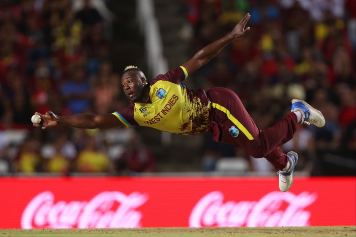 Andre Russell of West Indies fields off his own delivery during the ICC Men’s T20 Cricket World Cup West Indies & USA