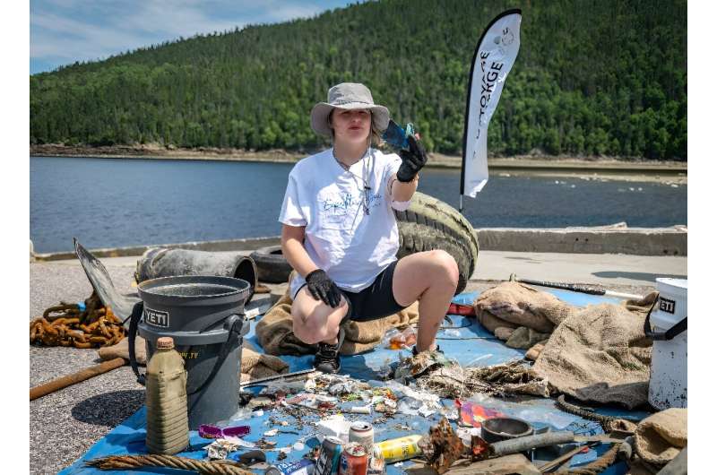 Laurence Martel, plastic pollution project manager for the Blue Organization, sorts waste collected in the Saguenay Fjord